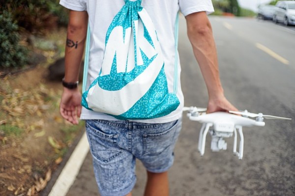 Man carrying a drone photo
