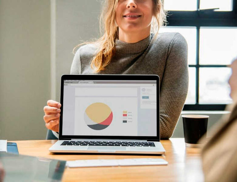 woman-showing-presentation-pie-chart
